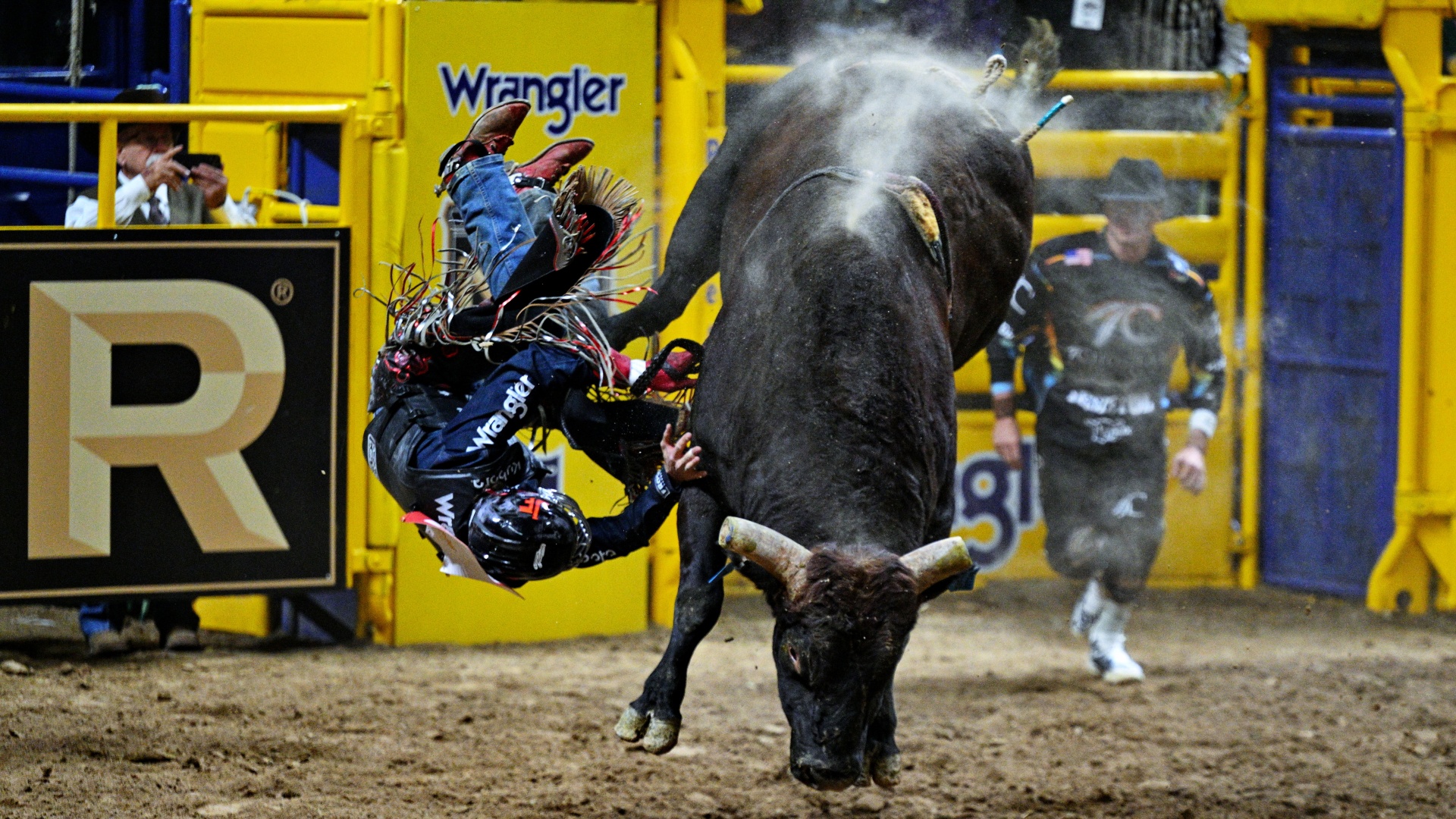 Josh Frost being thrown by Half Cocked the bull at the National Finals Rodeo NFR in 2024