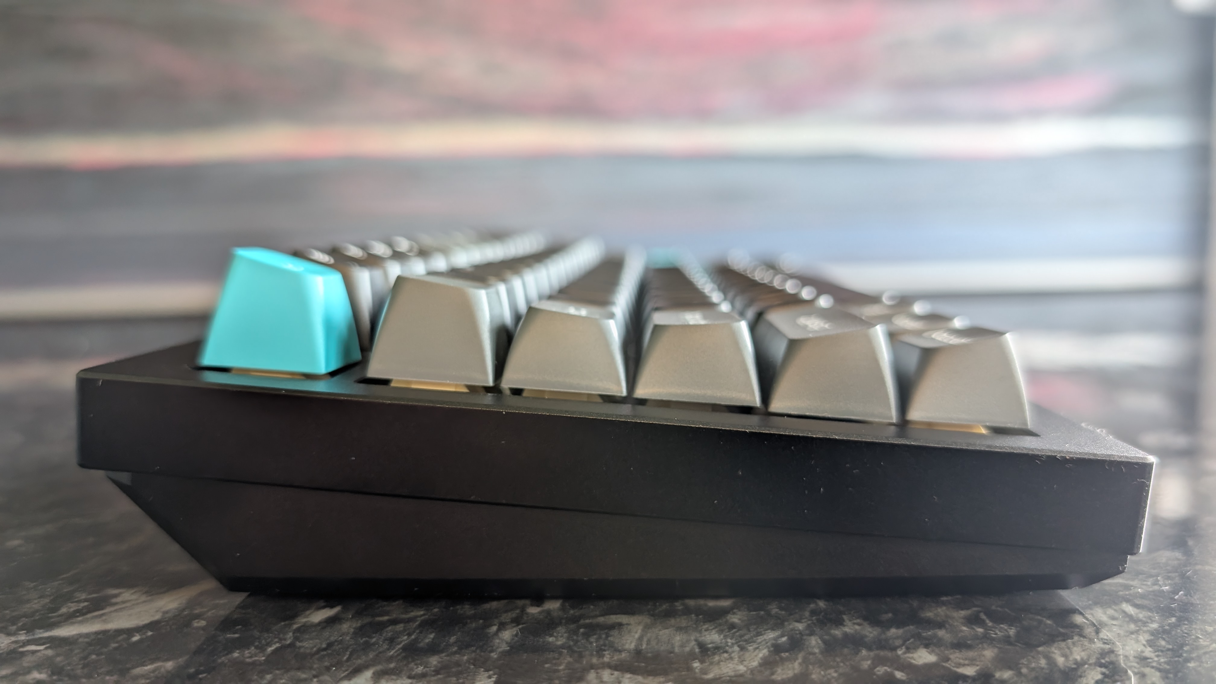 The Keychron Q1 Ultra 8K, photographed on a dark marble worktop.