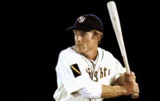 robert redford as a baseball player about to swing his bat in the movie the natural