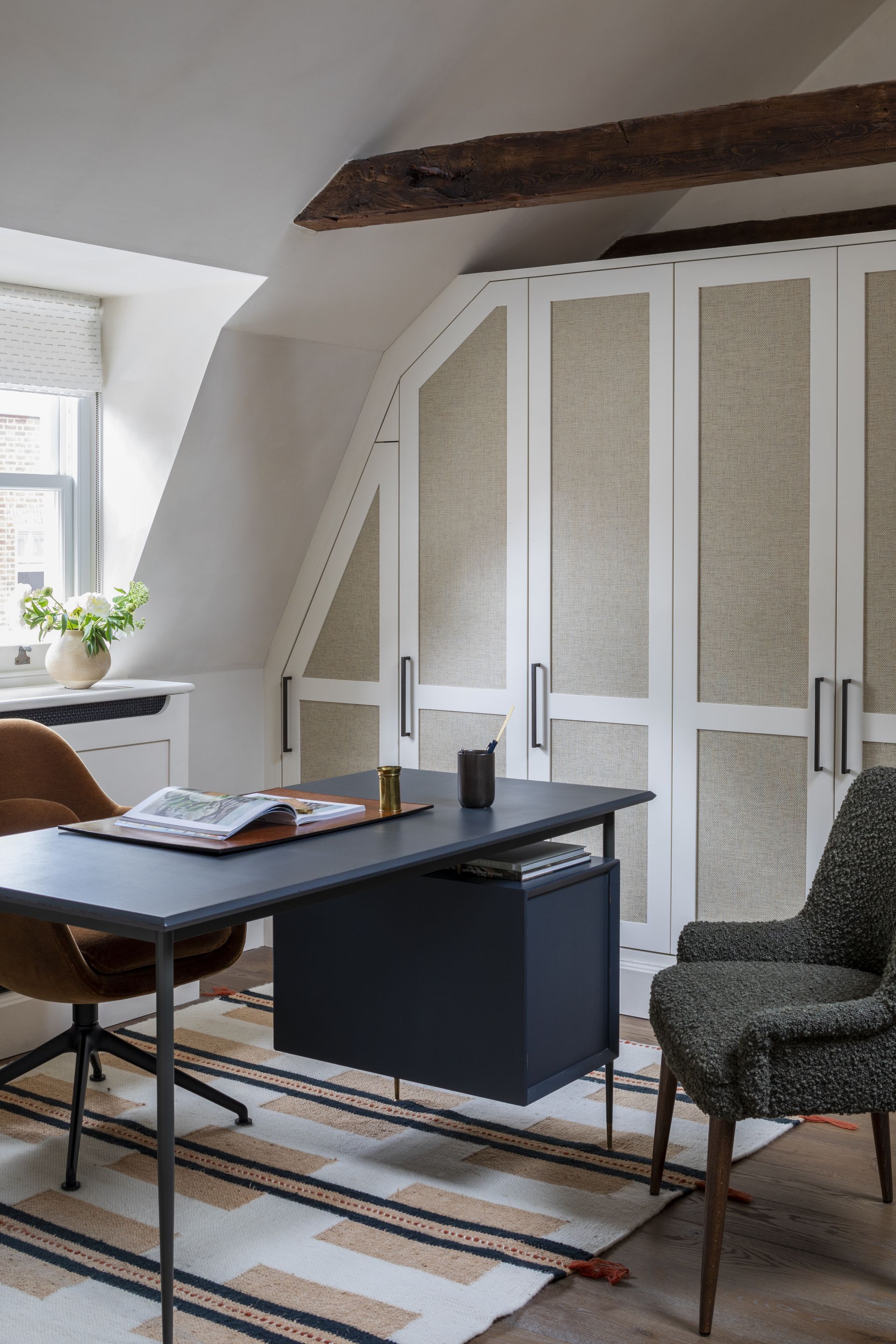 An office with black desk and chairs