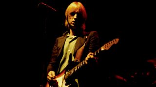 American Rock and Pop musician Tom Petty (1950 - 2017) plays guitar as he perfroms, with his band the Heartbreakers, during the &#039;Damn the Torpedoes&#039; tour at the Capitol Theatre, Passaic, New Jersey, June 27, 1980