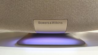 Bowers & Wilkins Zeppelin Pro Edition wireless speaker close up on illuminated pedestal and B&W log