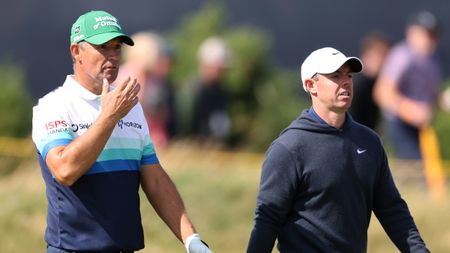 Padraig Harrington and Rory McIlroy (right) walk along at The Open Championship in 2024