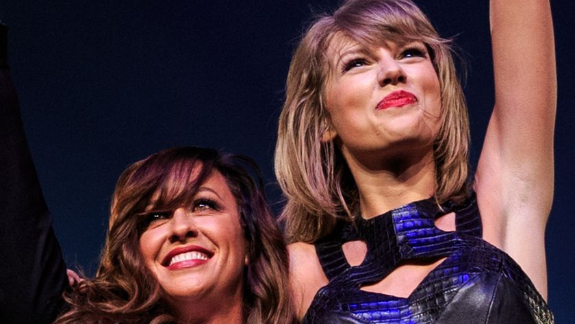 Alanis Morissette (L) and Taylor Swift perform onstage during Taylor Swift The 1989 World Tour