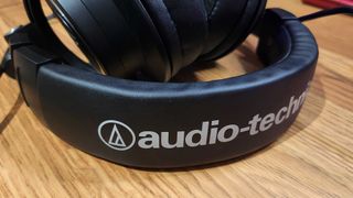 Audio-Technica ATH-M50xSTS StreamSet gaming headset on a chair