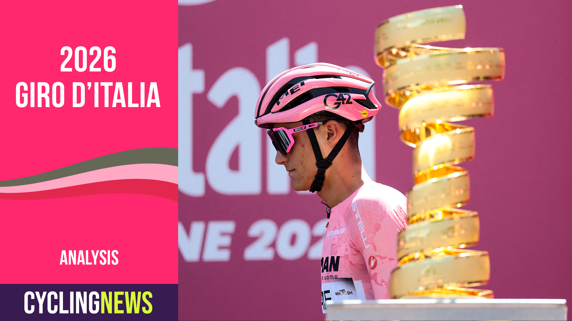 Isaac del Toro, in the pink jersey, pictured walking past the Giro d'Italia trophy