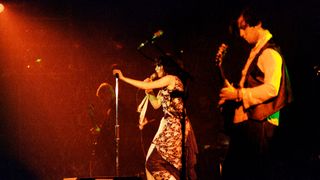John McGeoch onstage with Siouxsie and the Banshees
