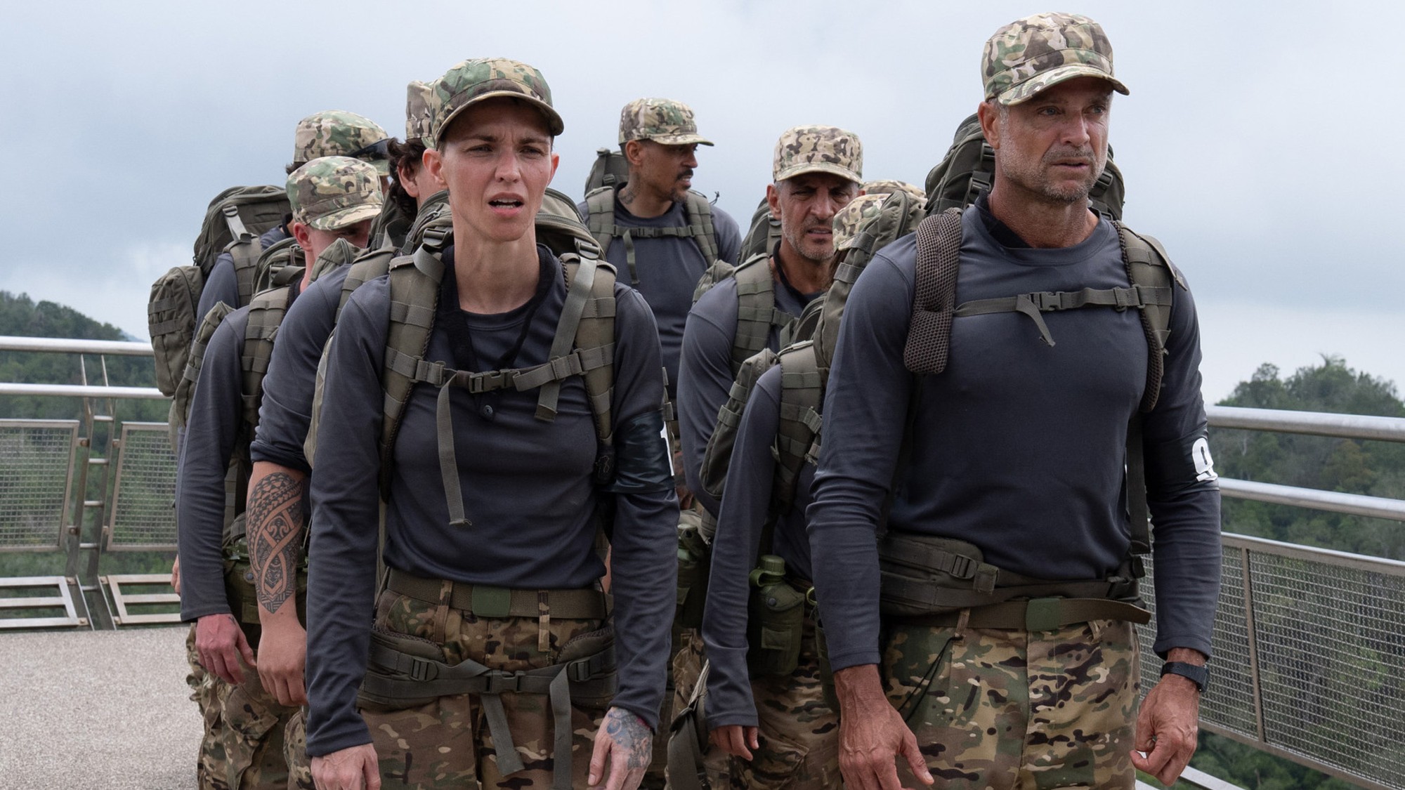 The recruits make their way to the challenge in a lined row of two.