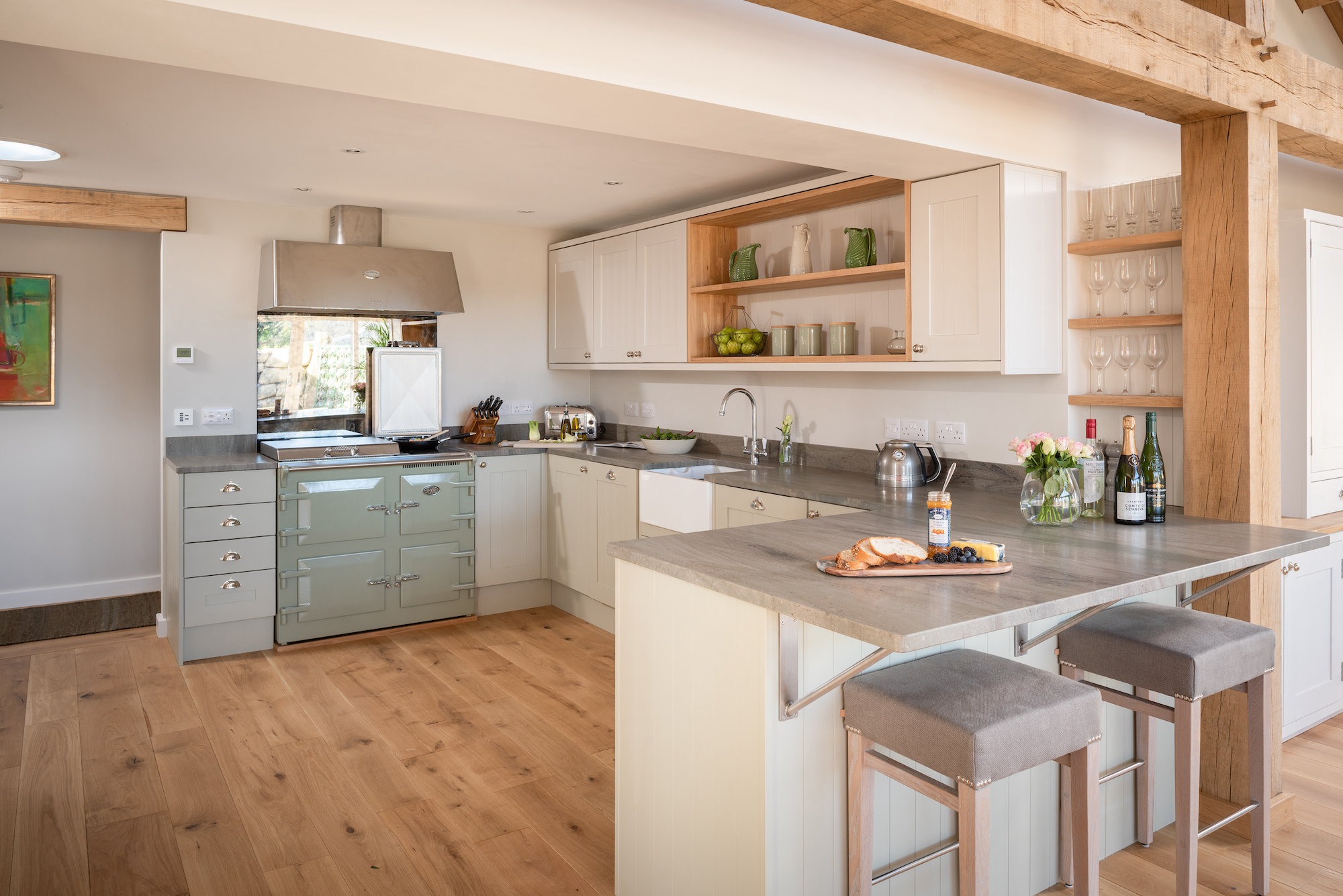 modern kitchen with grey worktop and white cupboards