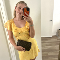 An editor wears a yellow dress. 