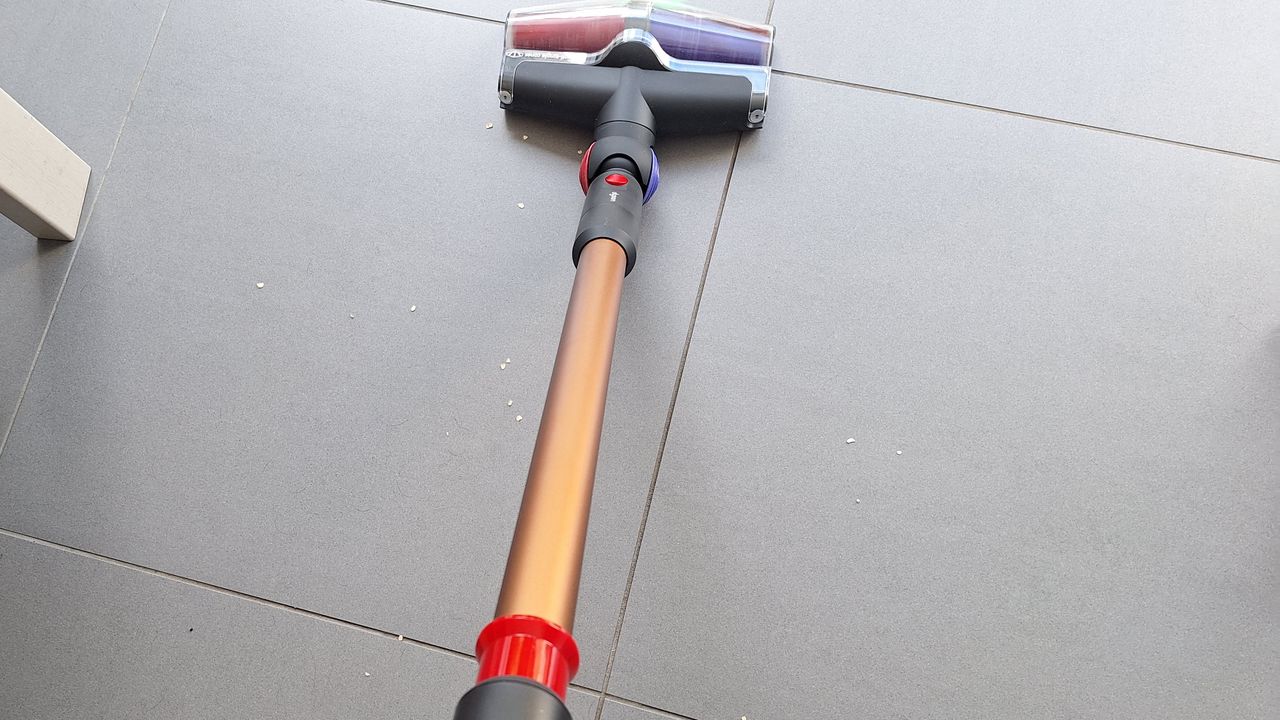 Dyson V16 during suction tests on a tiled floor