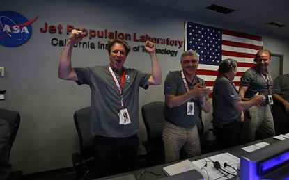Excited scientists react to Juno entering Jupiter's orbit.