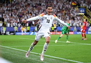 Manchester City target Germany Euro 2024 squad Jamal Musiala of Germany celebrates scoring his team's second goal during the UEFA EURO 2024 round of 16 match between Germany and Denmark at Football Stadium Dortmund on June 29, 2024 in Dortmund, Germany. (Photo by Shaun Botterill/Getty Images)