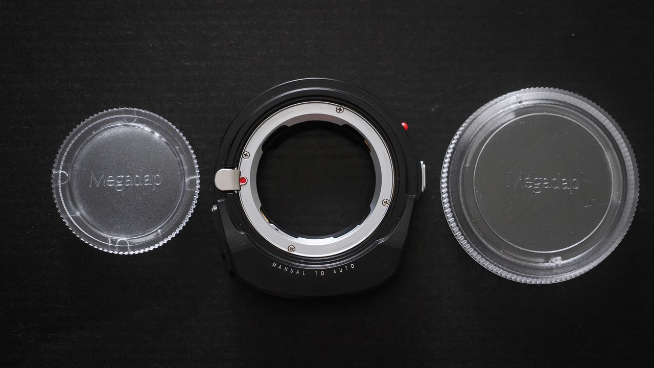 Megadap M2RF adapter on a black surface