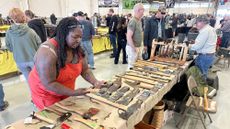 People shop at a prepper expo in Longmont, Colorado