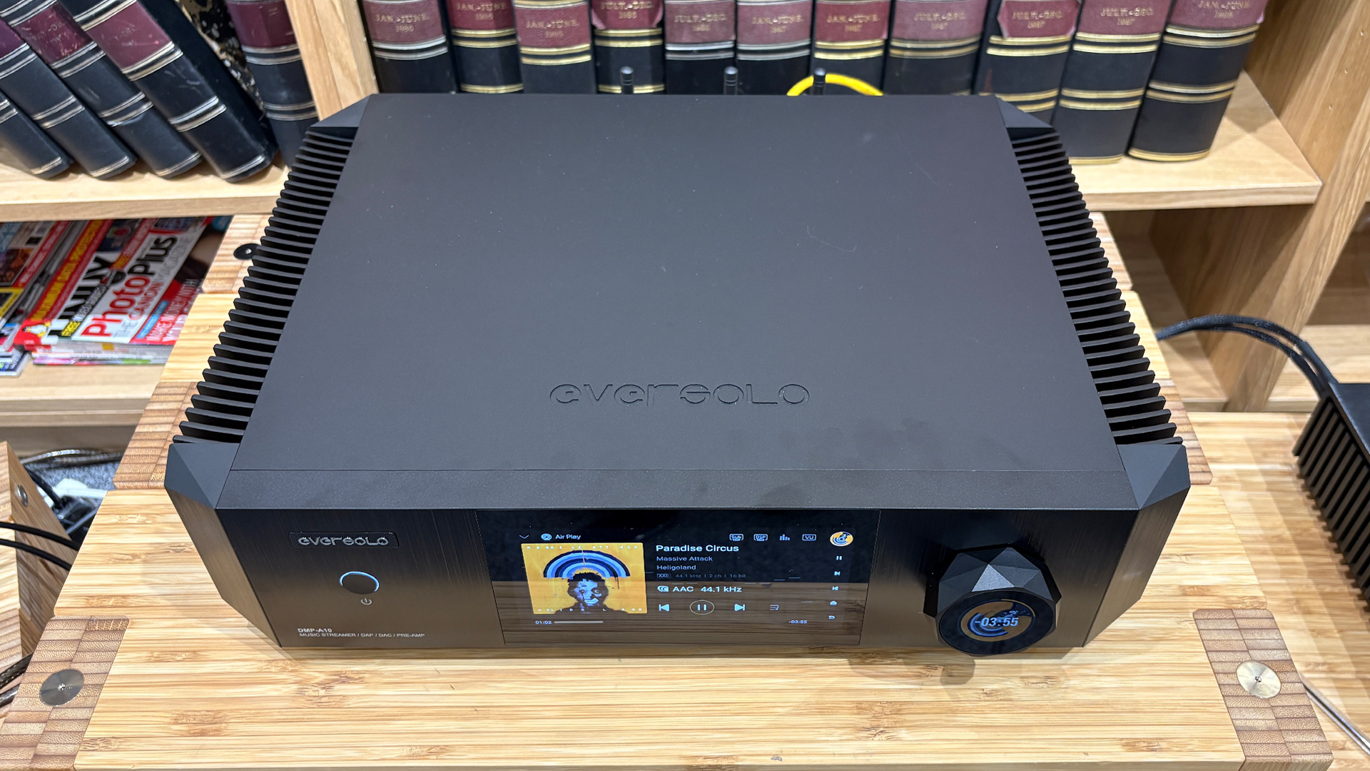 Eversolo DMP-A10 streaming amplifier on wooden hi-fi rack, slight top down view
