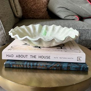 Anthro-esque DIY ruffle bowl stages on round coffee table with books