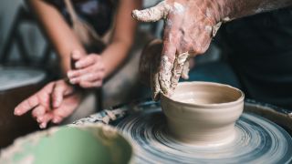 Woman holding a ceramics class