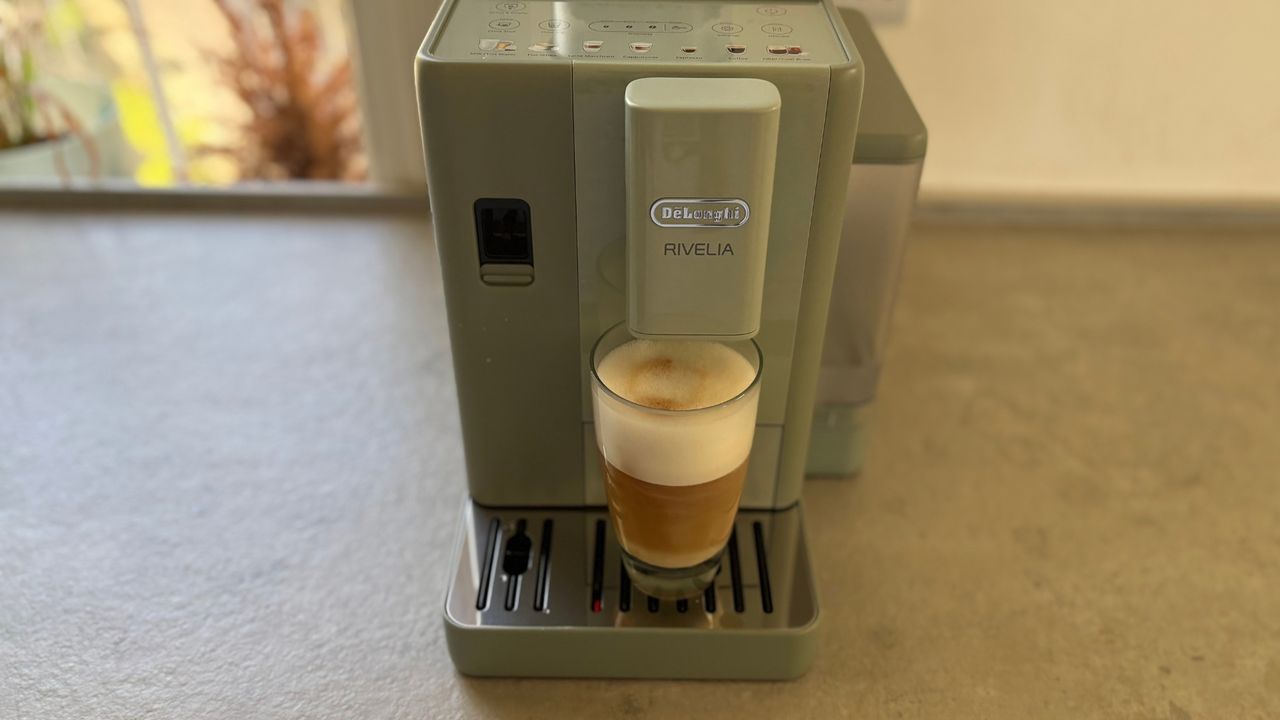 De'Longhi Rivelia Start Coffee Machine on the counter making a cappuccino