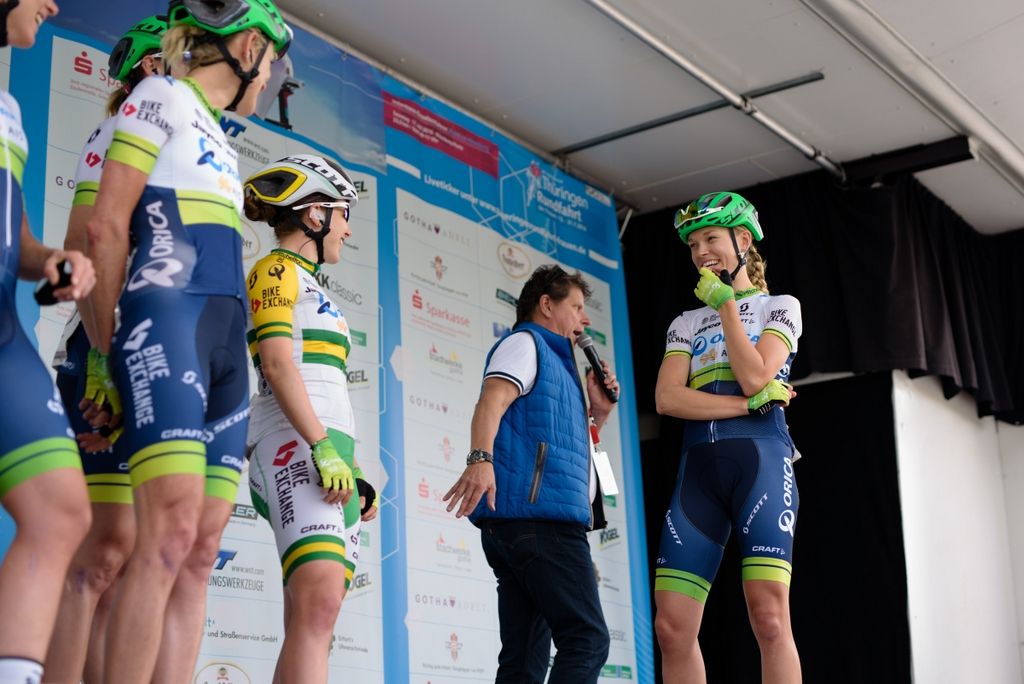 Tayler Wiles enjoys a lighter moment on the podium with her Orica-AIS teammates