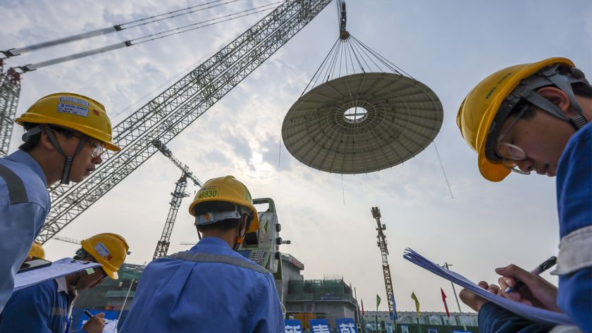 Engineers watching the dome be transported to the Small Nuclear Reactor.