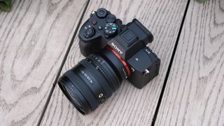 Sony A7 V camera on a wooden surface