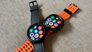 The Samsung Galaxy Watch 6 Classic (left) sitting atop the Galaxy Watch Ultra (right).