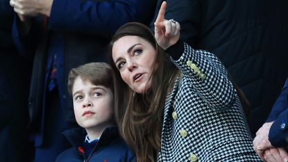 Kate Middleton pointing with Prince George