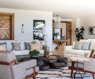 modern living room with white walls, muted colors through textiles and furnishings