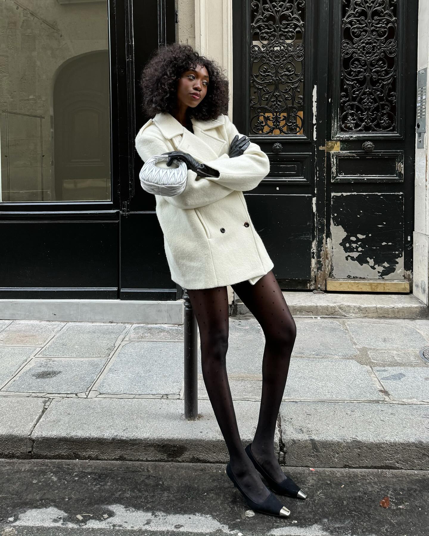 An image of @emmanuellek_ wearing the Miu Miu Wander bag, one of the best Miu Miu bags.