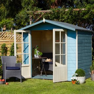 small pale blue summer house