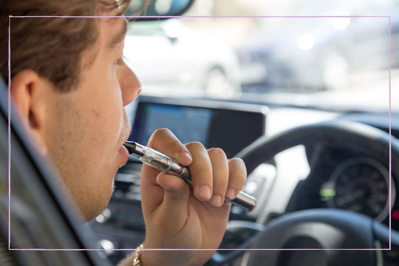 Man vaping as she&#039;s sat driving car