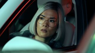 Amy (Ali Wong) in her car in Beef