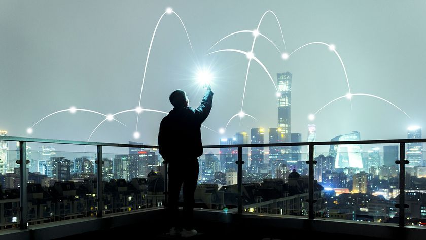 a person holding a wireless device and connecting to a wireless network