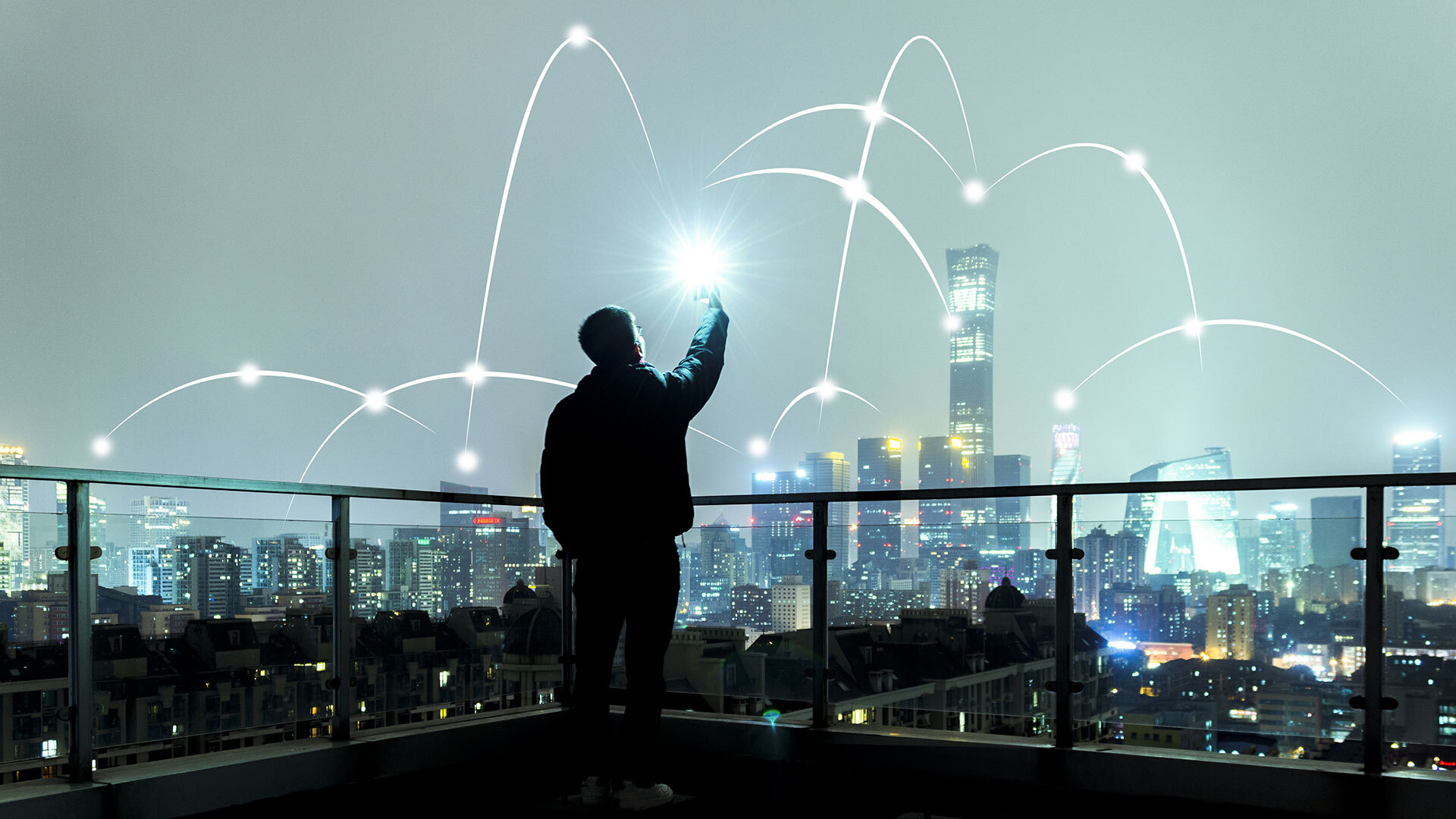 a person holding a wireless device and connecting to a wireless network