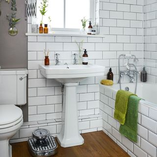 bathroom make over with white tiles wall