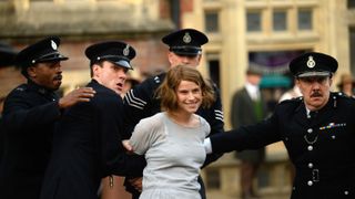 Rose Gooding (Jessie Buckley) being arrested by police officers in "Wicked Little Letters"