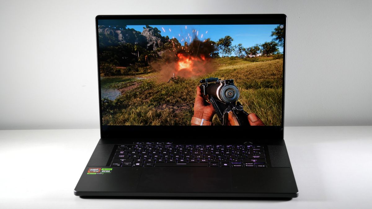 Asus ROG Zephyrus G16 (Ryzen AI 9) open on a white table with Far Cry 6 on screen.