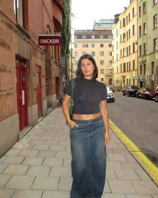 @isabellecoheen wearing a denim midi skirt and cropped t-shirt