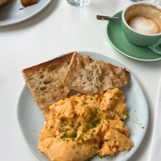 Scrambled eggs, toast and a coffee