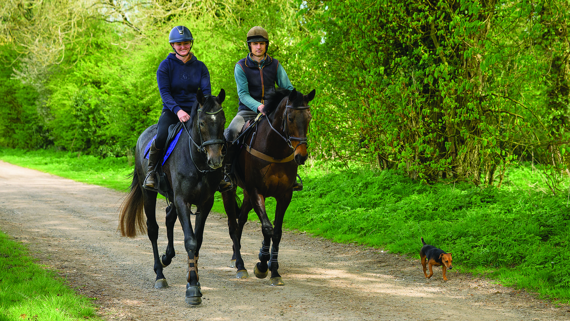 Tom Strawson hacks out on Public Address with his part-time groom Robyn Lawrie on her own horse.