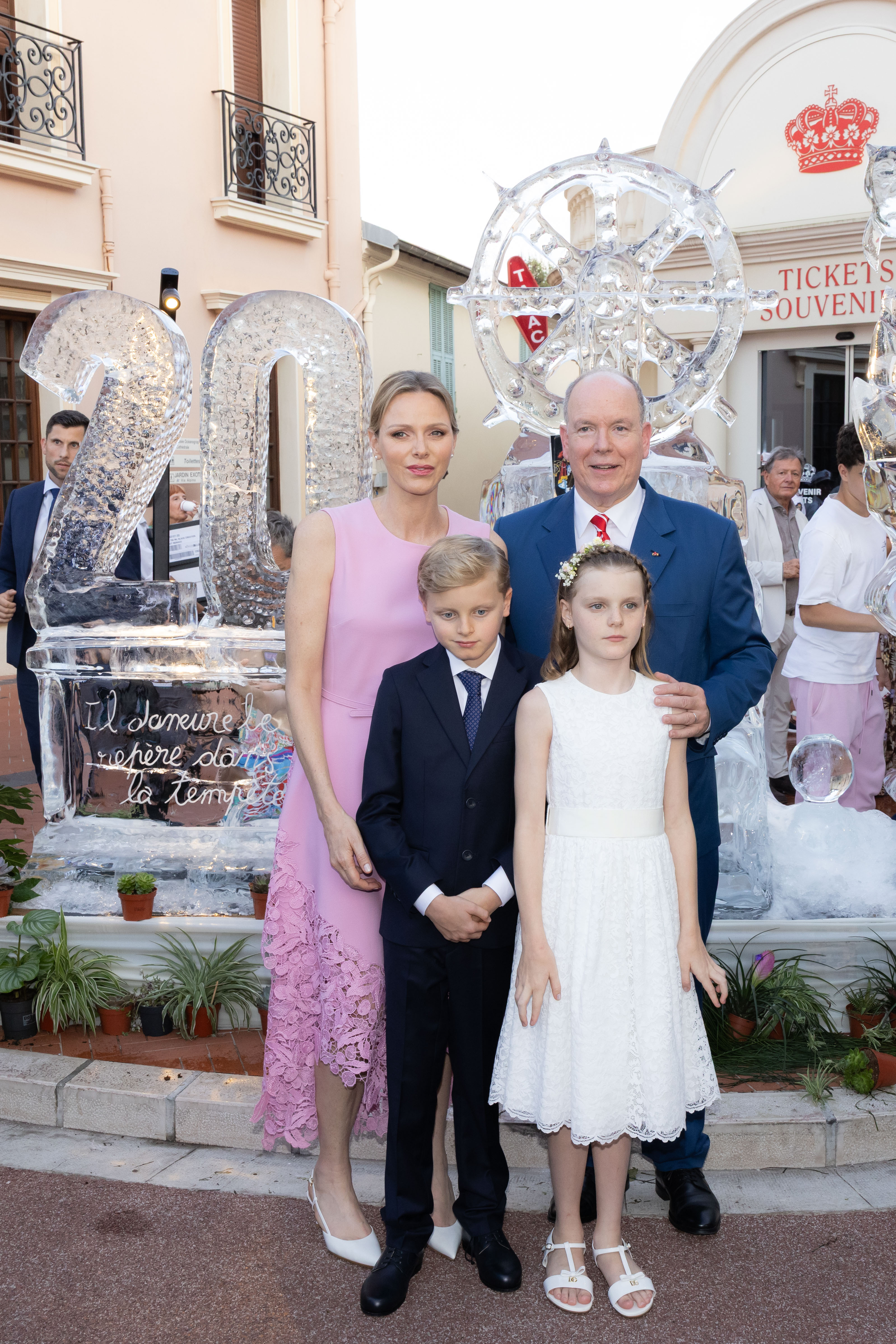 Princess Charlene wears a pink Barbiecore Oscar de la Renta dress and poses with daughter Princess Gabriella