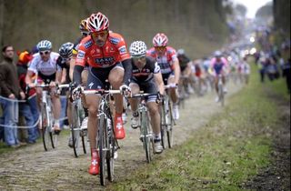 Fabian Cancellara (Saxo Bank) leads the charge through the Arenberg forest at Paris-Roubaix