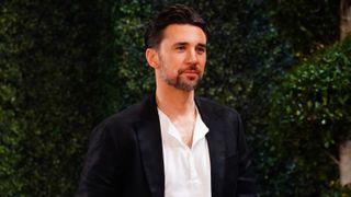 Billy Flynn in a black blazer smirking as Cane Ashby in The Young and the Restless