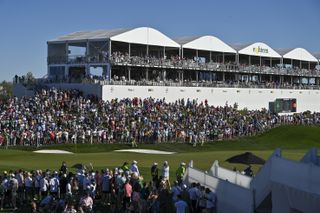 Fans surround the 18th hole at TPC Scottsdale