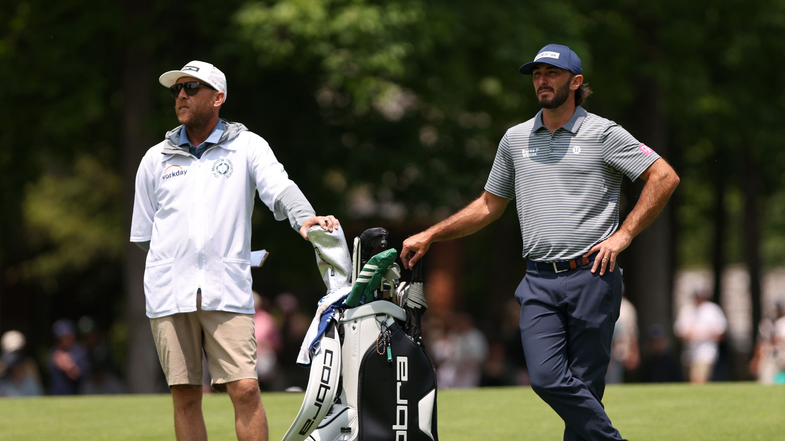 Max Homa (right) and caddie Bill Harke stand either side of Homa&#039;s bag at the Memorial Tournament