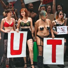 A group of women wearing very little in a public protest against slut shaming.