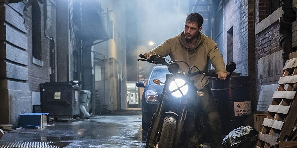 Venom Eddie Brock sits on his motorcycle in a steamy alley