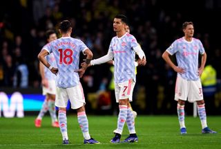 Manchester United’s Cristiano Ronaldo (centre) and Bruno Fernandes appear dejected after Watford’s Ismaila Sarr (not pictured) scores their side’s second goal of the game during the Premier League match at Vicarage Road, Watford. Picture date: Saturday November 20, 2021