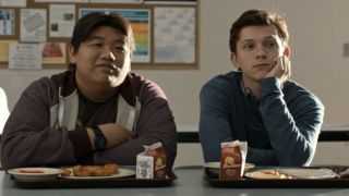 Ned (Jacob Batalon) and Peter Parker (Tom Holland) sit at lunch in Spider-Man: Homecoming